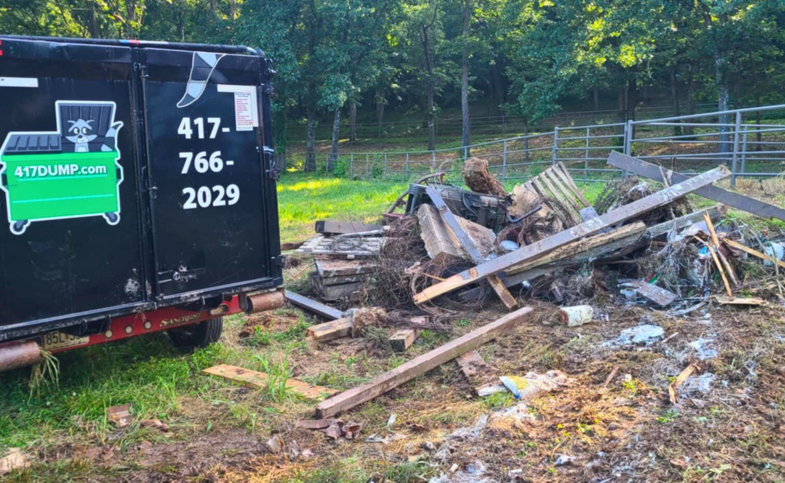 A loaded 417 Dumpster Rental roll-off holding debris from a garage cleanout in Springfield, MO